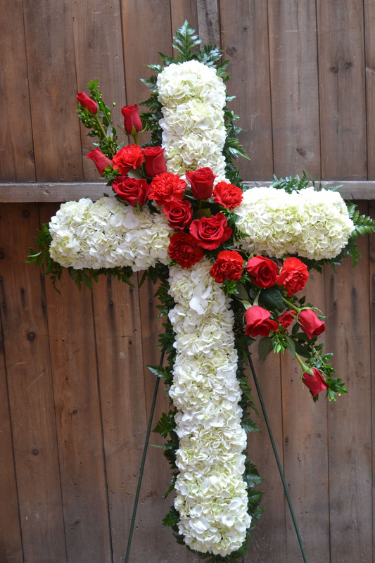 White Carnation Cross with Red Roses